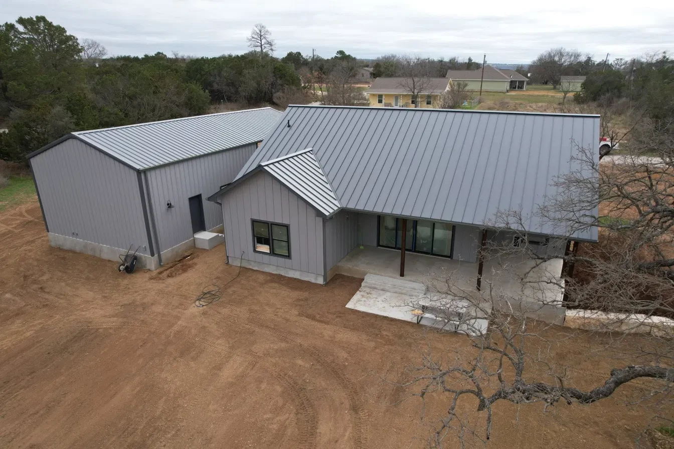 Metal roof and seamless gutters on a two-story home
